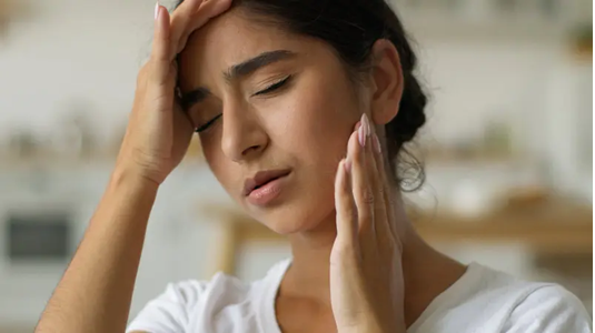 Dentist in Surat performing TMD Treatment at Cuspid Dental